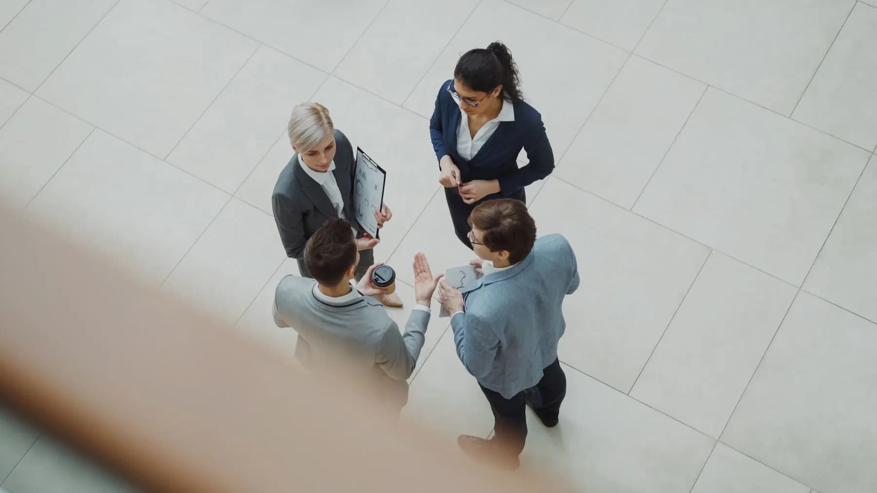 Research professionals collaborating around a table