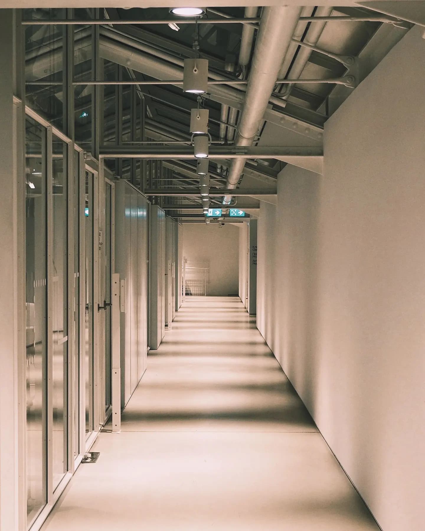 A modern operational corridor with glass partitions